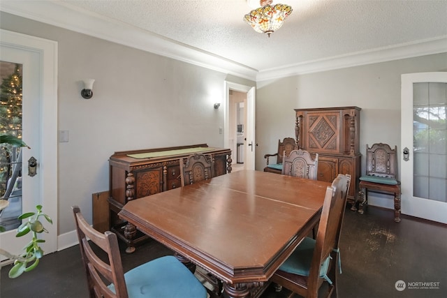 dining space featuring french doors, a textured ceiling, and ornamental molding