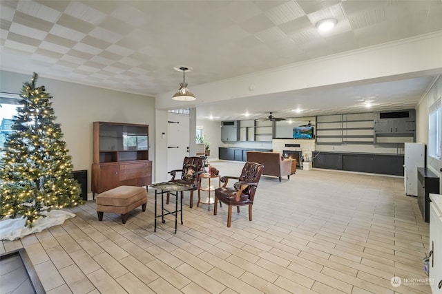 dining area featuring ceiling fan and ornamental molding