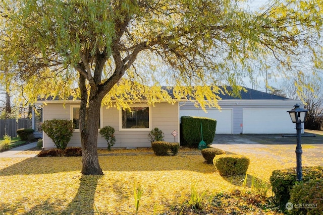 single story home featuring a garage