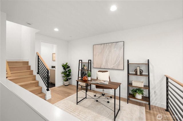 office with recessed lighting, baseboards, and light wood-style flooring