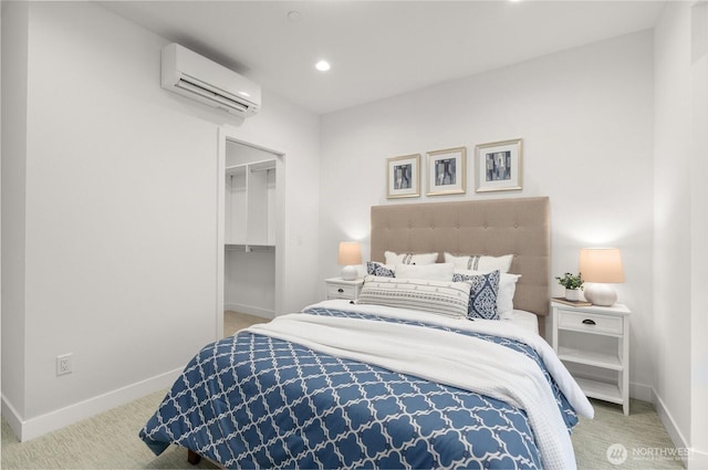 bedroom featuring baseboards, recessed lighting, a wall mounted air conditioner, and carpet