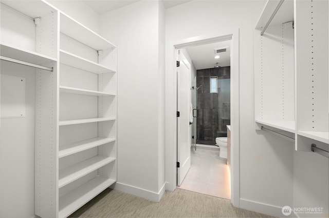 spacious closet featuring visible vents