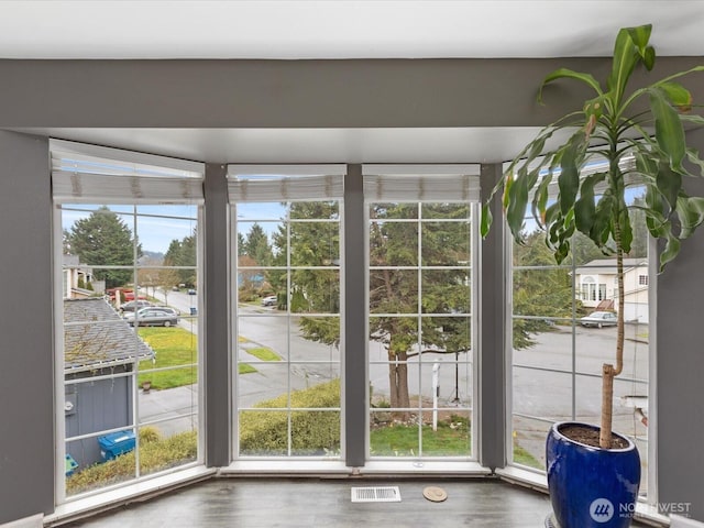 entryway with visible vents and wood finished floors