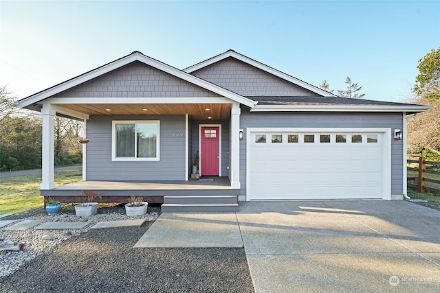 view of front of house featuring covered porch and a garage