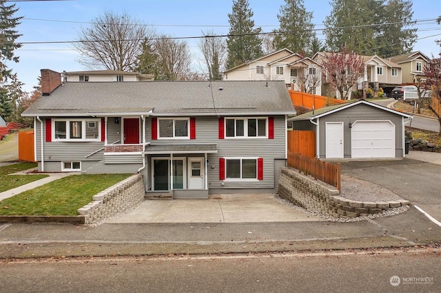 view of front of property featuring an outbuilding and a garage