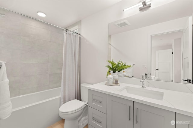 full bathroom with toilet, vanity, and shower / tub combo with curtain