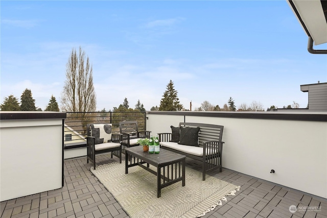 view of patio / terrace with a balcony and an outdoor hangout area