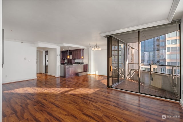 interior space featuring dark hardwood / wood-style flooring, crown molding, a wall of windows, and a notable chandelier