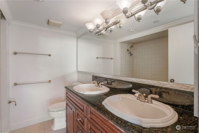 bathroom featuring tile patterned flooring, vanity, toilet, and ornamental molding