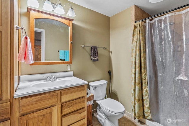 bathroom with a shower with curtain, vanity, toilet, and tile patterned flooring