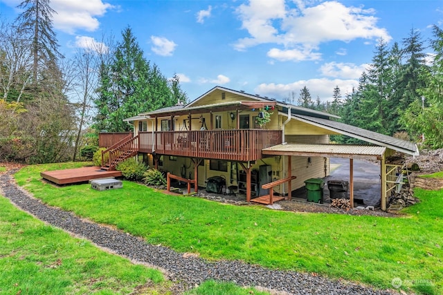 back of property featuring a lawn and a deck