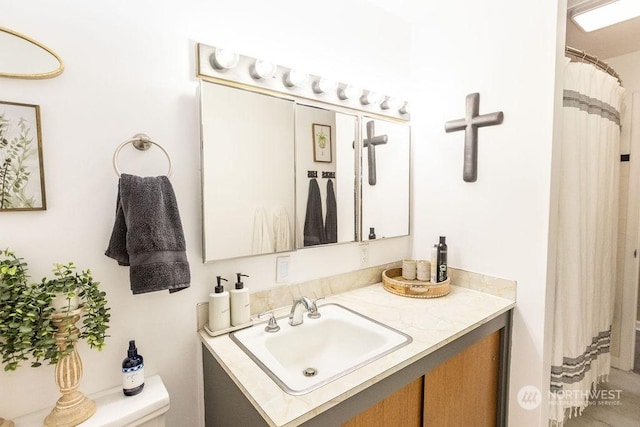 bathroom with vanity and toilet