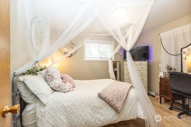 bedroom with wood-type flooring