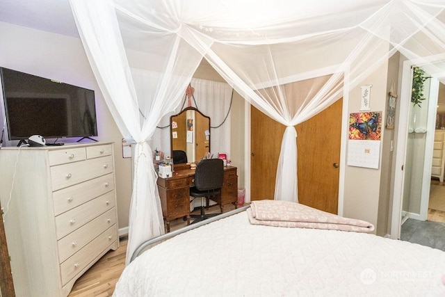 bedroom with wood-type flooring