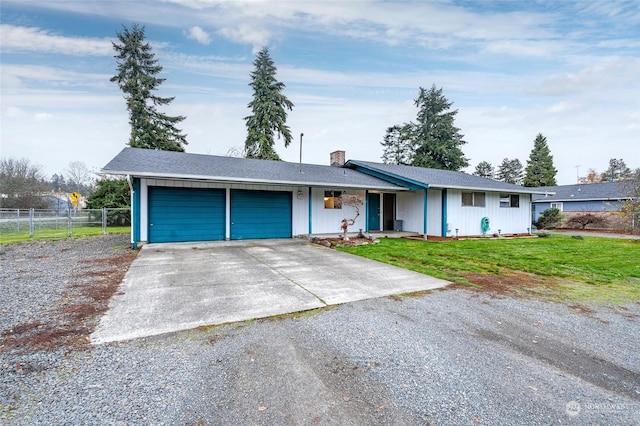 ranch-style house with a front lawn and a garage