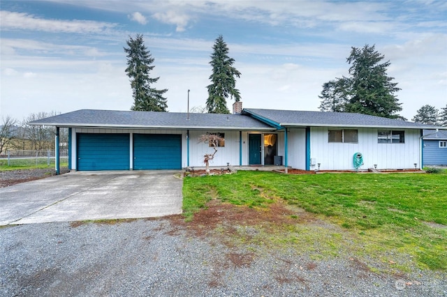 ranch-style house with a garage and a front lawn