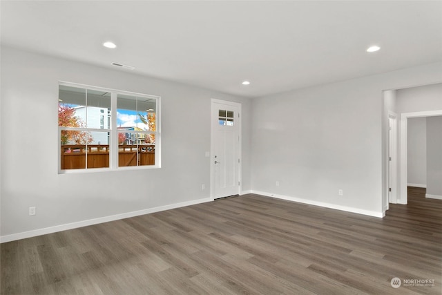 empty room with wood-type flooring