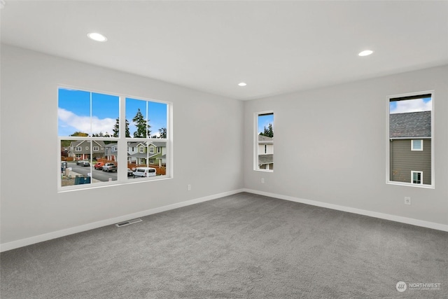 unfurnished room featuring carpet floors