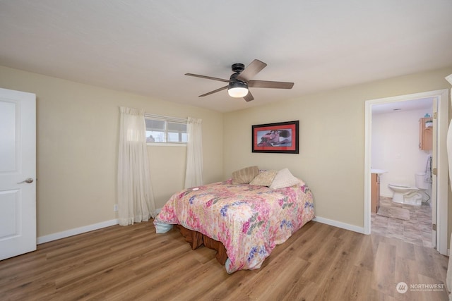 bedroom with connected bathroom, ceiling fan, and light hardwood / wood-style flooring