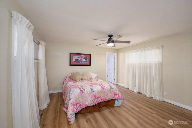 bedroom with light wood-type flooring and ceiling fan