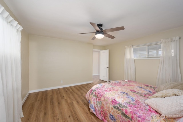 bedroom featuring hardwood / wood-style flooring and ceiling fan