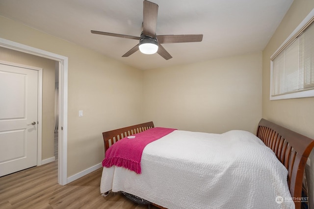 bedroom with light hardwood / wood-style flooring and ceiling fan