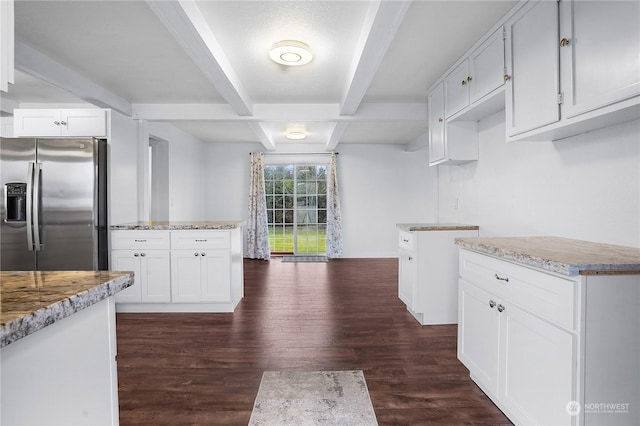 kitchen with stainless steel fridge with ice dispenser, light stone counters, beamed ceiling, dark hardwood / wood-style floors, and white cabinets