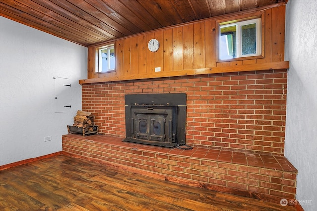 details featuring a wood stove, wood ceiling, and hardwood / wood-style flooring