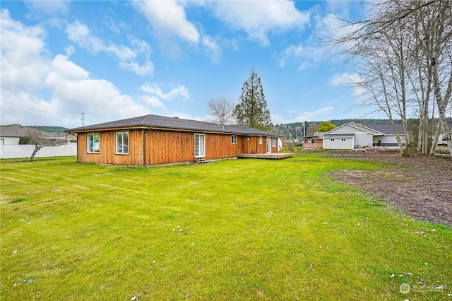 rear view of house with a lawn