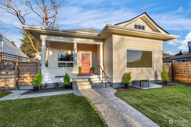 bungalow-style house featuring a front yard