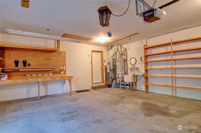 garage featuring sink, a workshop area, a garage door opener, and water heater