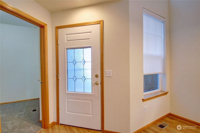 entrance foyer with light hardwood / wood-style floors