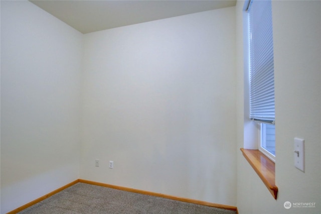 empty room with carpet flooring