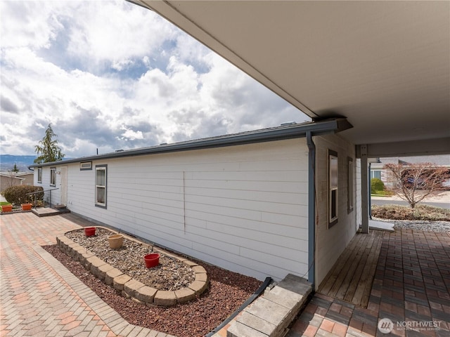 view of side of property featuring a patio