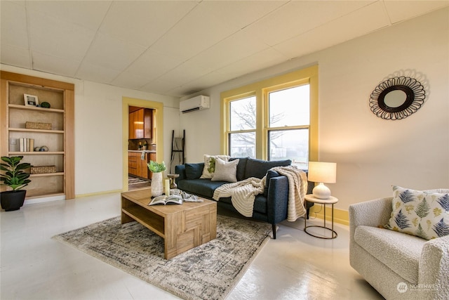 living room with built in shelves, concrete floors, and a wall mounted air conditioner