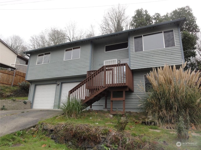 back of house featuring a garage