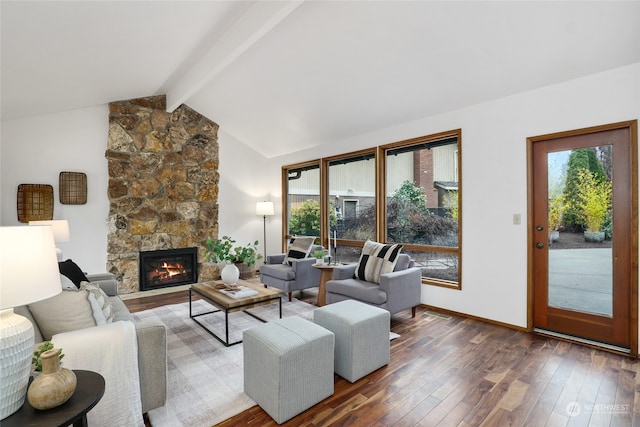 living room with vaulted ceiling with beams, a fireplace, and dark hardwood / wood-style floors