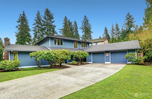 front of property featuring a garage and a front yard