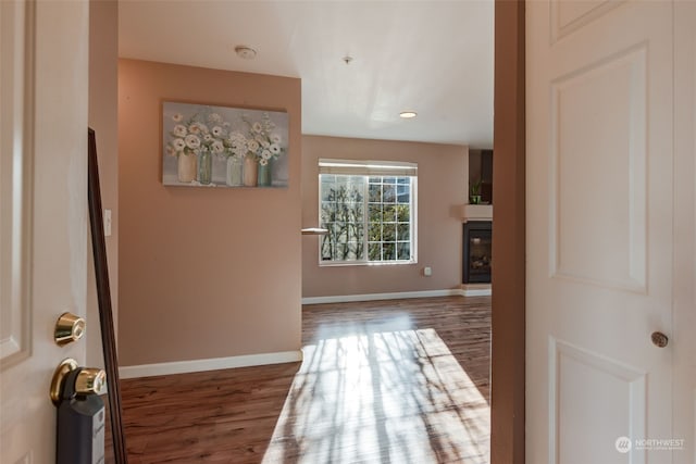 hall with dark hardwood / wood-style floors