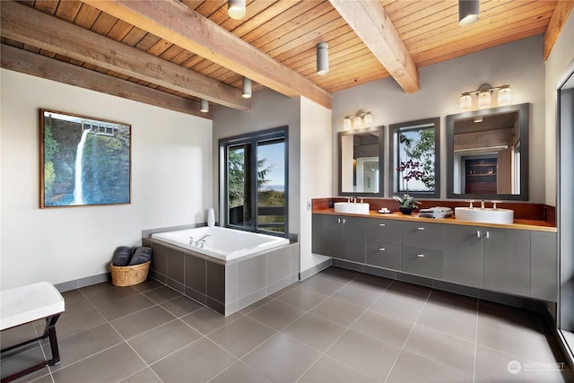 bathroom with vanity, wooden ceiling, a bath, tile patterned floors, and beamed ceiling