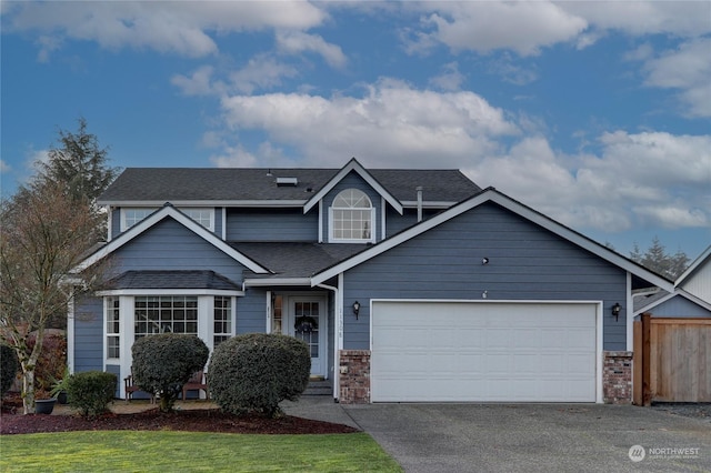 view of front facade featuring a front lawn and a garage