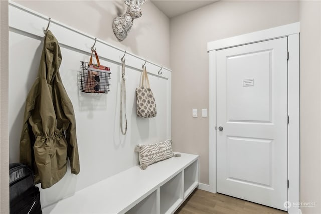 mudroom with light hardwood / wood-style floors