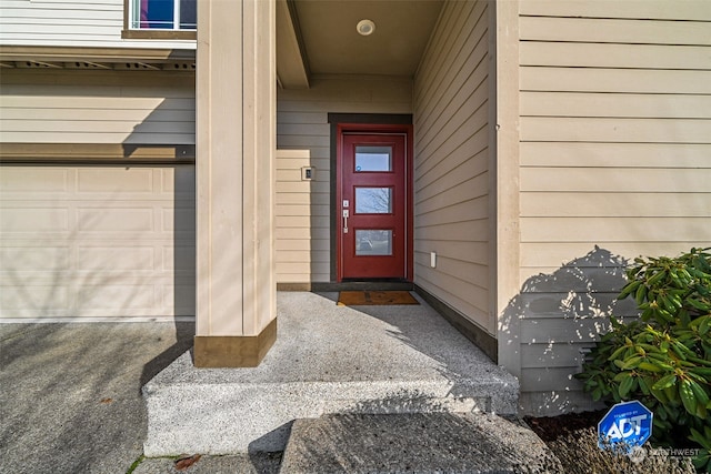 property entrance with a garage