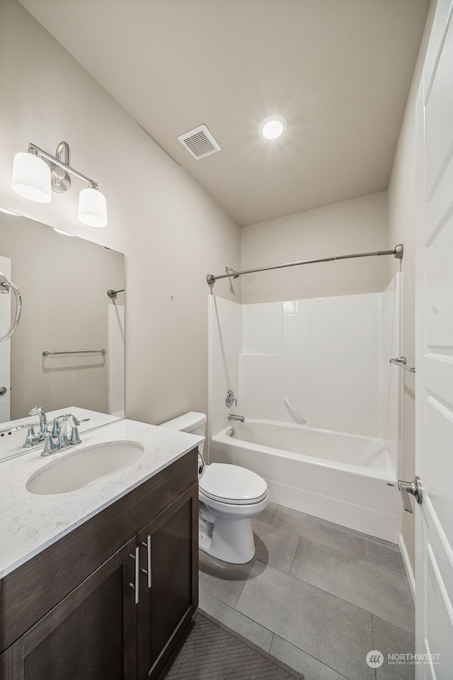 full bathroom with tile patterned floors, shower / washtub combination, vanity, and toilet