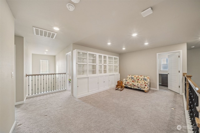 sitting room with carpet flooring