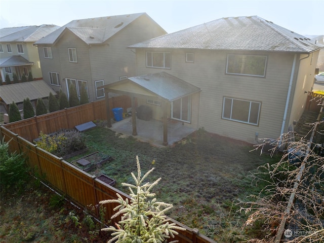 rear view of house featuring a patio