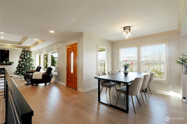 dining area with light wood-style flooring, baseboards, crown molding, and recessed lighting