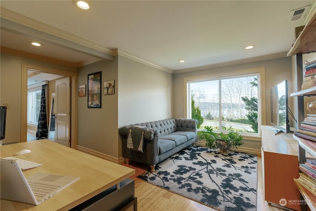 living room featuring recessed lighting, light wood-style flooring, visible vents, and ornamental molding