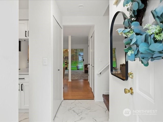 hall with light hardwood / wood-style floors