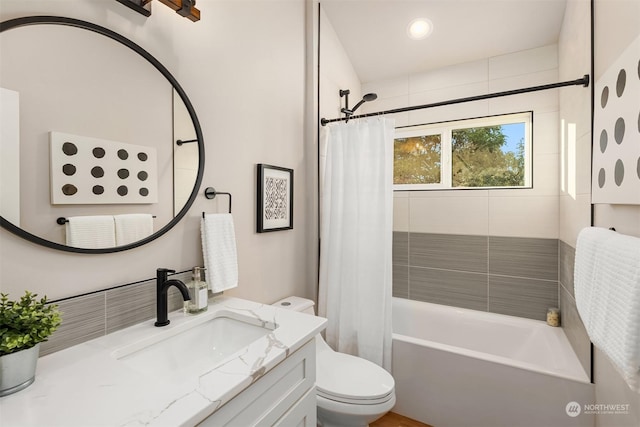 full bathroom with vanity, toilet, and shower / bathtub combination with curtain